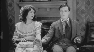 Buster Keaton holds hands with The Girl
